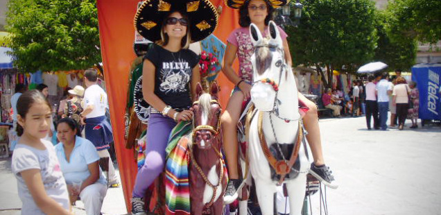 Cindy in Mexico on a fake horse