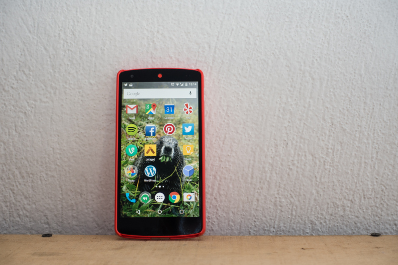 Red Nexus 5 smart phone with red case